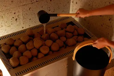 a person is pouring food into a bin at TOKIO's HOTEL in Tokyo