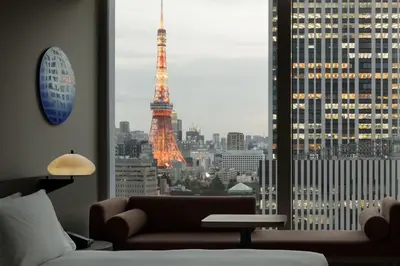 a living room with a view of the eiffel tower at Hotel Toranomon Hills, The Unbound Collection By Hyatt in Tokyo