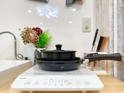 a pan sitting on top of a stove in a kitchen at Shinjuku center2/4mins from Shinjuku sta./Max4 in Tokyo
