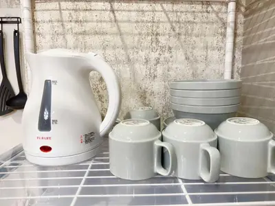 a tea kettle and cups on a kitchen counter at Shinjuku center2/4mins from Shinjuku sta./Max4 in Tokyo