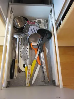 a drawer filled with kitchen utensils at Cheese Cozy Condo in Tokyo