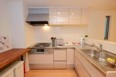 a kitchen with a sink and a stove top oven at ACOE HATSUDAI - 4BR Entire Home Upscale Area in Tokyo