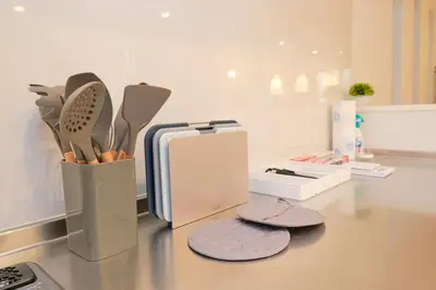 a counter top with a container of kitchen utensils at ACOE HATSUDAI - 4BR Entire Home Upscale Area in Tokyo