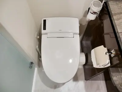 a bathroom with a white toilet in a room at Okubo Shinjuku new open Capsule hotel in Tokyo