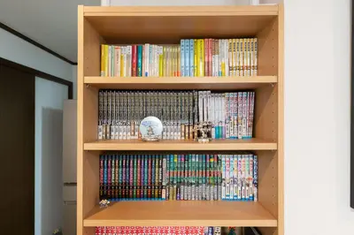 a book shelf filled with lots of dvds at \u677e\u5cf6\u96c5\u5c45 in Tokyo