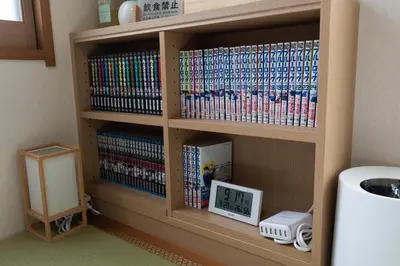 a book shelf filled with lots of dvds at \u677e\u5cf6\u96c5\u5c45 in Tokyo