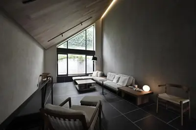 a living room with a couch and chairs and a window at Kakurega Tokyo villa in Tokyo