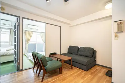 a living room with a couch and a table at Two-bedroom, 6-minute walk to the Yamanote Line in Tokyo