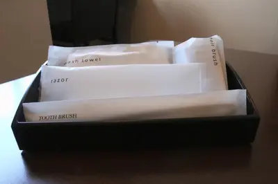 a black box filled with white papers on a table at Shinjuku Sun Park Hotel in Tokyo