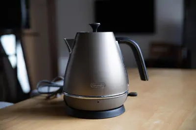 a kettle sitting on top of a wooden table at LUCKY house53 in Tokyo