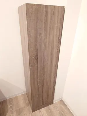 a wooden door in the corner of a room at LUCKY house53 in Tokyo