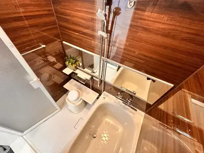 a bathroom with a sink and a shower and a toilet at LUCKY house53 in Tokyo