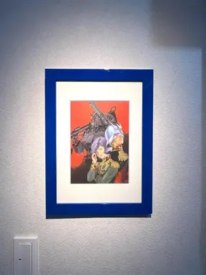 a framed picture of overwatchauts on a wall at Hotel Tokyo Hub in Tokyo