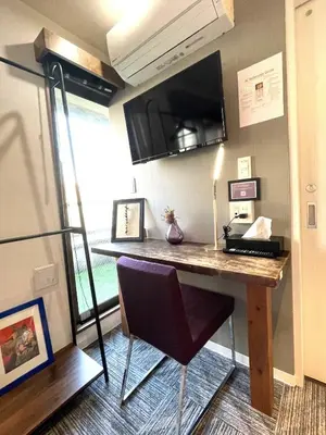 a kitchen with a desk with a chair in a room at Hotel Tokyo Hub in Tokyo