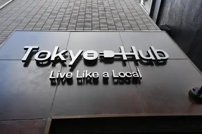 a sign for the tokyo huff live like a local at Hotel Tokyo Hub in Tokyo