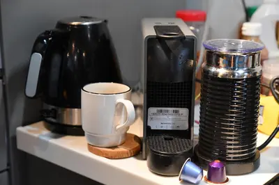 a coffee maker and a cup on a counter at Hotel Tokyo Hub in Tokyo