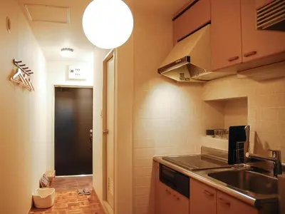 a kitchen with a sink and a counter top at \u30b5\u30f3\u30e2\u30fc\u30eb\u30af\u30ec\u30b9\u30c8202 in Tokyo