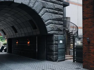 a building with a stone wall and a staircase at \u30b5\u30f3\u30e2\u30fc\u30eb\u30af\u30ec\u30b9\u30c8202 in Tokyo