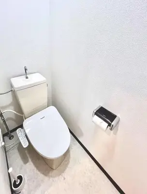 a bathroom with a white toilet and a roll of toilet paper at Emoto Asakusa in Tokyo