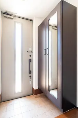 a bathroom with two glass doors and a mirror at FUJIMI TOWN HOUSE in Tokyo
