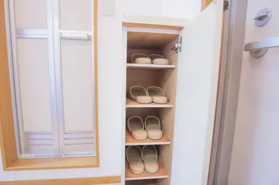 a closet with a pair of shoes in it at \u9591\u9759\u306a\u4f4f\u5b85\u8857_\u6696\u304b\u304f\u5c45\u5fc3\u5730\u306e\u826f\u3044\u30c7\u30b6\u30a4\u30f3 EoE-2 in Tokyo