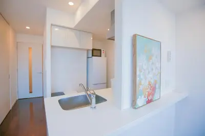 a kitchen with a sink and a refrigerator at 10min walk to Shinjuku YEoE-2 in Tokyo
