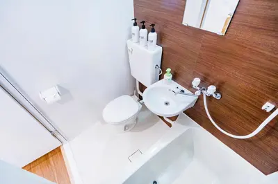 a bathroom with a sink and a toilet and a tub at 10min walk to Shinjuku YoY5 in Tokyo