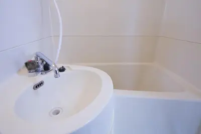 a bathroom with a sink and a bath tub at walk to Higahsi Shinjuku sta. WoSI in Tokyo