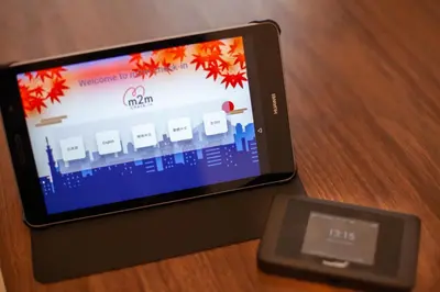 a cell phone and a scale on a table at ks\u897f\u65e9\u7a32\u7530 in Tokyo