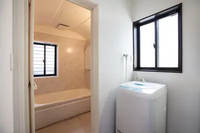 a bathroom with a tub and a toilet and a sink at ks\u897f\u65e9\u7a32\u7530 in Tokyo