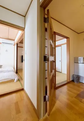 a room with a bed and a large mirror at Tokyo Central Shinjuku-ward Japanese Tatami House 2DK-\u65b0\u5bbf03 in Tokyo