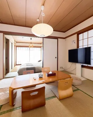 a living room with a wooden table and a television at Tokyo Central Shinjuku-ward Japanese Tatami House 2DK-\u65b0\u5bbf03 in Tokyo