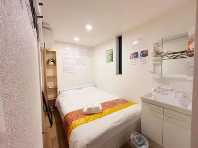 a small room with a bed and a sink at Hananogo Ikebukuro - Vacation STAY 09224v in Tokyo
