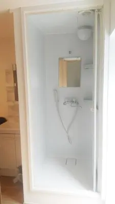 a white bathroom with a sink and a mirror at Hananogo Ikebukuro - Vacation STAY 09224v in Tokyo