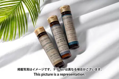 two bottles of essential oils sitting on a table at Kisetsu\u5927\u68eeII in Tokyo