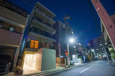 an empty city street at night with a street light at Kisetsu\u5927\u68eeII in Tokyo