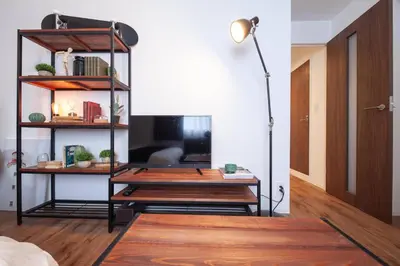 a room with a desk and a lamp at Trym\u62bc\u4e0a in Tokyo