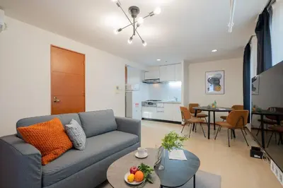 a living room with a couch and a table at \u30b0\u30e9\u30ca\u30fc\u30c9\u516d\u672c\u6728 in Tokyo