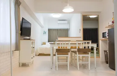 a kitchen and dining room with a table and chairs at \u30d5\u30ed\u30fc\u30ea\u30c3\u30b7\u30e521 in Tokyo