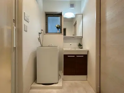 a small bathroom with a sink and a mirror at nestay villa tokyo oyama in Tokyo