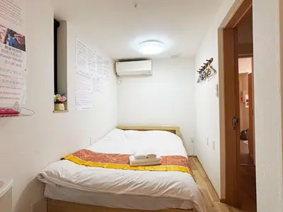 a small bedroom with a bed in a room at Hananogo Ikebukuro - Vacation STAY 16064v in Tokyo