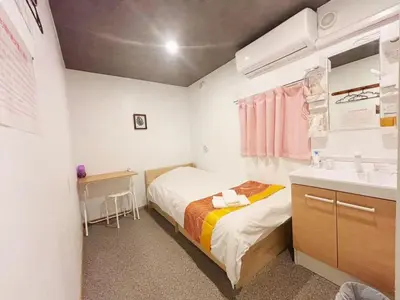 a small bedroom with a bed and a sink at Hananogo Ikebukuro - Vacation STAY 16071v in Tokyo