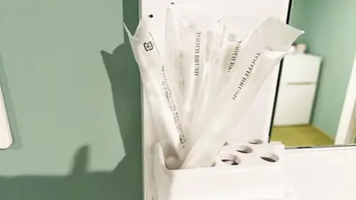 a white bag with rolls of toilet paper in front of a mirror at Hananogo Ikebukuro - Vacation STAY 16098v in Tokyo