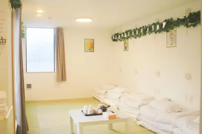 a living room with white couches and a table at Hananogo Ikebukuro - Vacation STAY 16098v in Tokyo