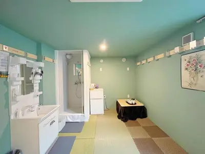 a blue bathroom with a sink and a shower at Hananogo Ikebukuro - Vacation STAY 16116v in Tokyo