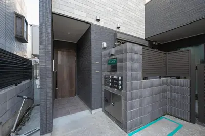a building with a parking meter on the side of it at Livion III in Tokyo