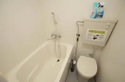 a bathroom with a toilet and a bath tub at YK building in Tokyo