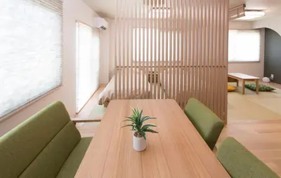 a conference room with a wooden table and green chairs at \u30d1\u30eb\u30c6\u30e9\u30b9\u5bcc\u58eb\u898b in Tokyo