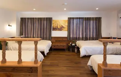 a bedroom with two beds and a painting on the wall at \u30d1\u30eb\u30c6\u30e9\u30b9\u5bcc\u58eb\u898b in Tokyo