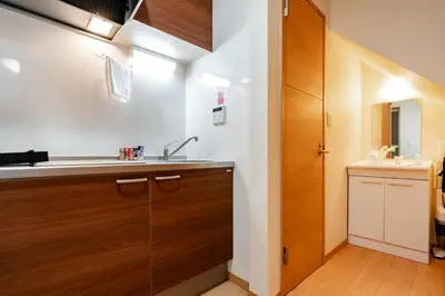 a kitchen with a sink and a counter top at Ferio in Tokyo